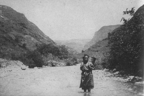 A LONELY TRAVELER

This picture was taken far out in untraveled China Far West. For days
you meet no sign of human habitation, and woe betide you if the river
rises!