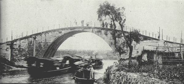 TYPICAL SINGLE-SPAN BRIDGE OF INLAND CHINA.

Engineers say that China possesses bridges of more varied design than
any other country.