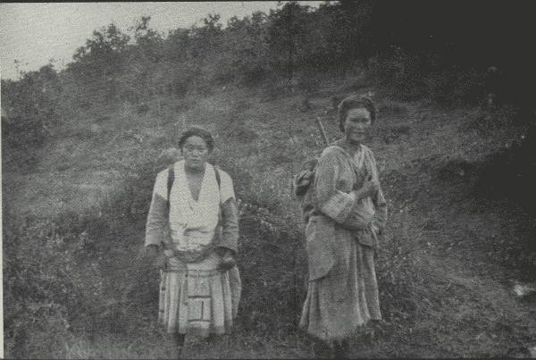 TWO VERY PRACTICAL WOMEN

Though their tribes have lived on same range of mountains "for eighty
centuries," they speak different languages and lead different life
generally. (One carries baby.)