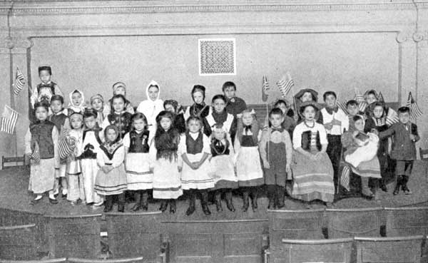 Children of Many Nationalities at Christmas
Celebration in a New York School.

Chinese, Italians, Swedes, Irish, English, German, French, Russian,
Austrian.