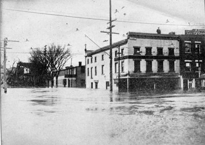 The engraving shows a view of Broadway, Watervliet, New York, the principal business street of that city, covered with eight feet of water