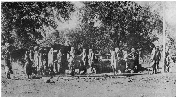 Drawing water from the village well