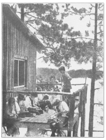 A group of girls busy over beadwork