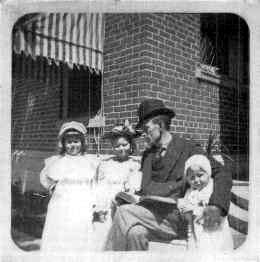EUGENE FIELD TELLING A STORY TO 'SISSY' KNOTT AND 'LISBETH AND MARTHA WINSLOW.