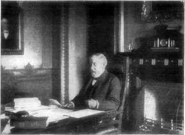MR. BLAINE AT HIS DESK IN THE STATE DEPARTMENT.