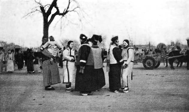 A Manchu Country Fair: The figures in the foreground are
all Manchu women and girls.