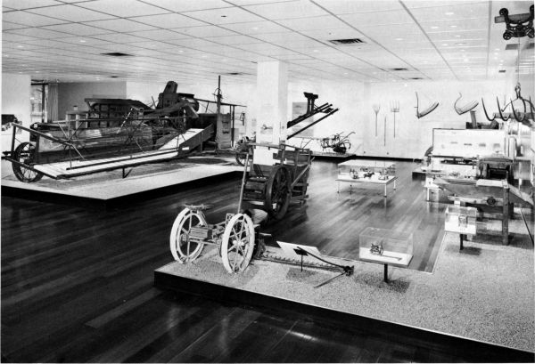 Figure 20.--A view in the Hall of Farm Machinery, National Museum of History and Technology.
The Holt combine in 1887 (Catalog No. 241) is at left. The Victor mowing machine of 1880
(Catalog No. 137) is in right foreground.
