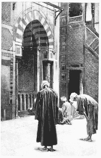 BEFORE THE SACRED NICHE
From a photograph by Sebah, Cairo