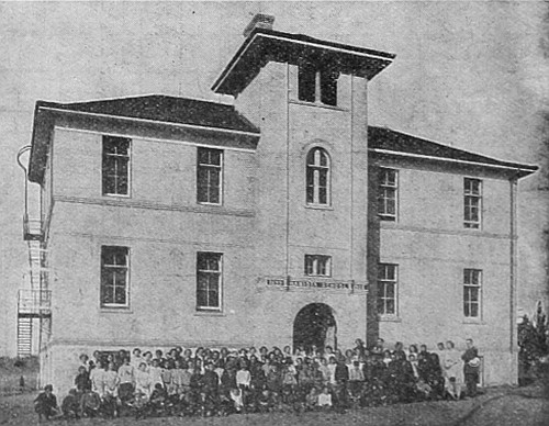Typical school, such as many towns are building in
Western Canada, where the education of the children is carefully looked
after.