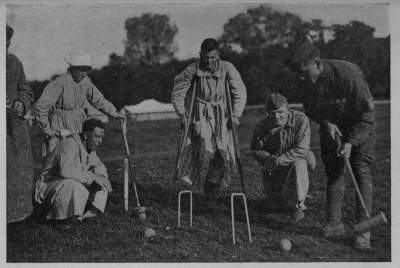"NEVER SAY DIE"
Sorely wounded, our boys at the great A. R. C. field hospital in the Auteuil race track outside
of Paris, kept an active interest in games and sports
