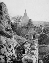 SHEIKH ADI.
The upper end of the buildings showing the forecourt and entrance
gateway: and (apparently) “the Proprietor,” seated on the wall above.