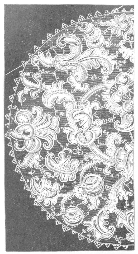 Half circle of lace with heavy foliage
    motifs