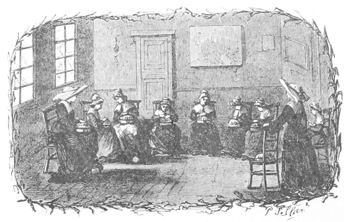 Seven girls woring on pillows with two
    teachers