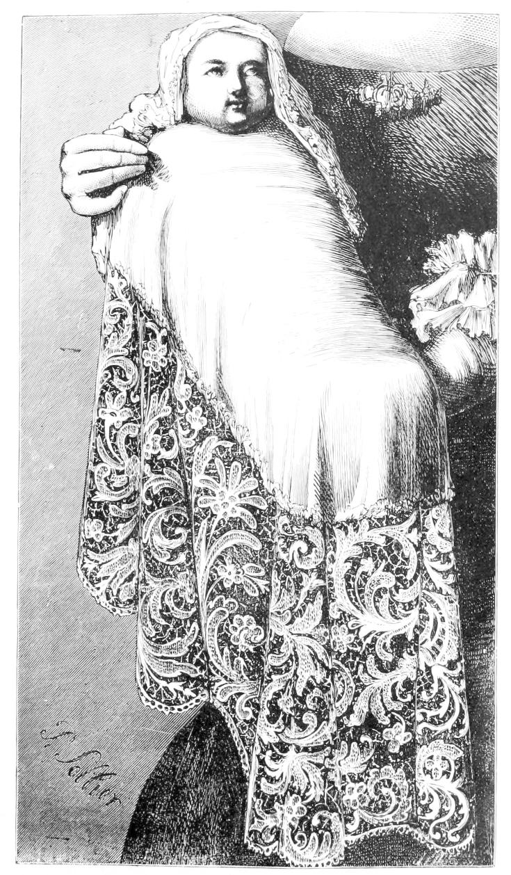 Baby draped in long flowing lace