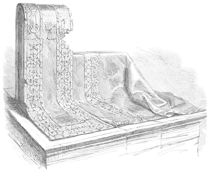 Monument resembling draped cloth with
    lace