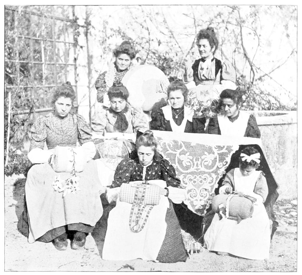 Eight women making lace on pillows