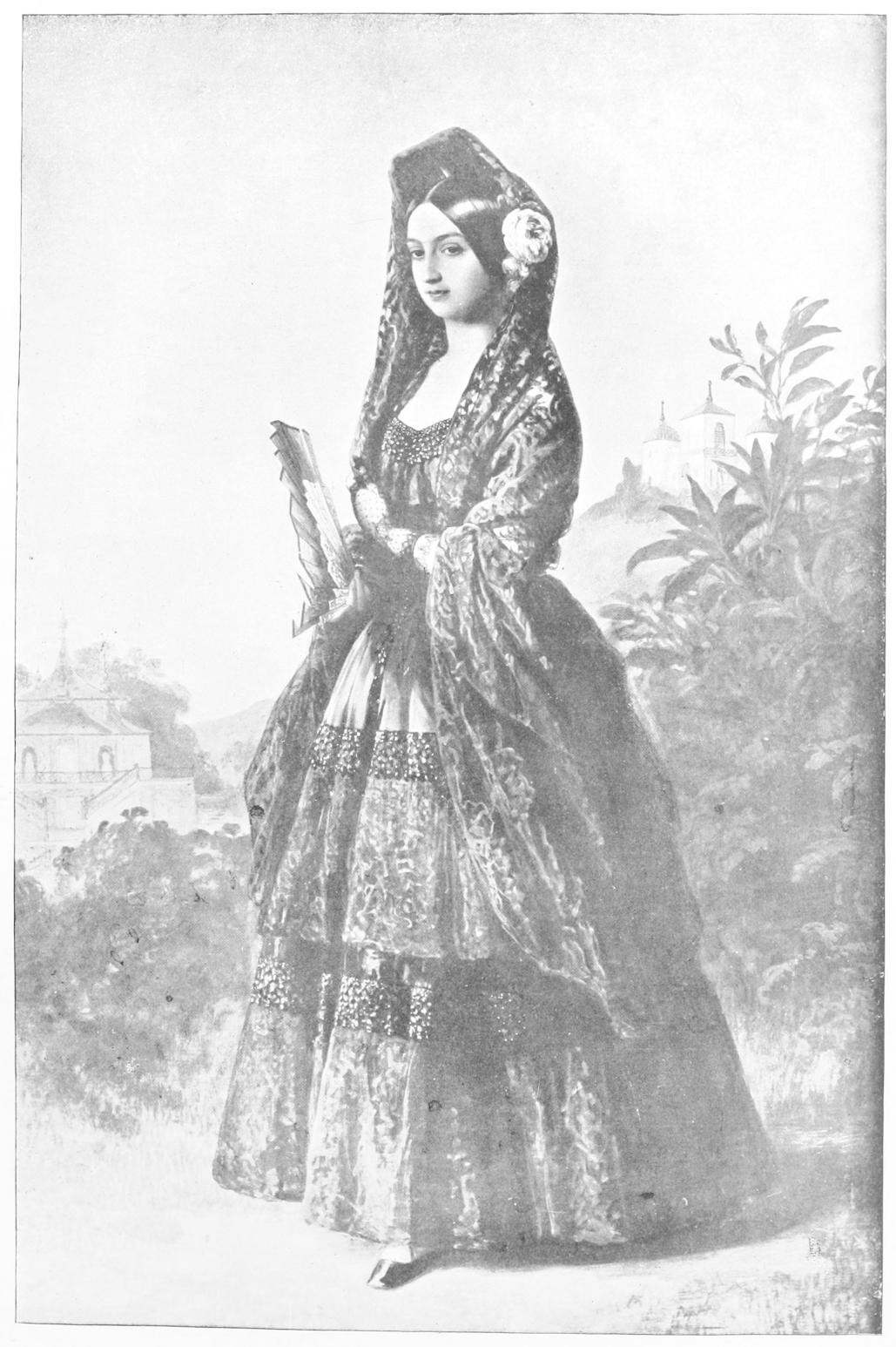 Woman in full length dress with veil
